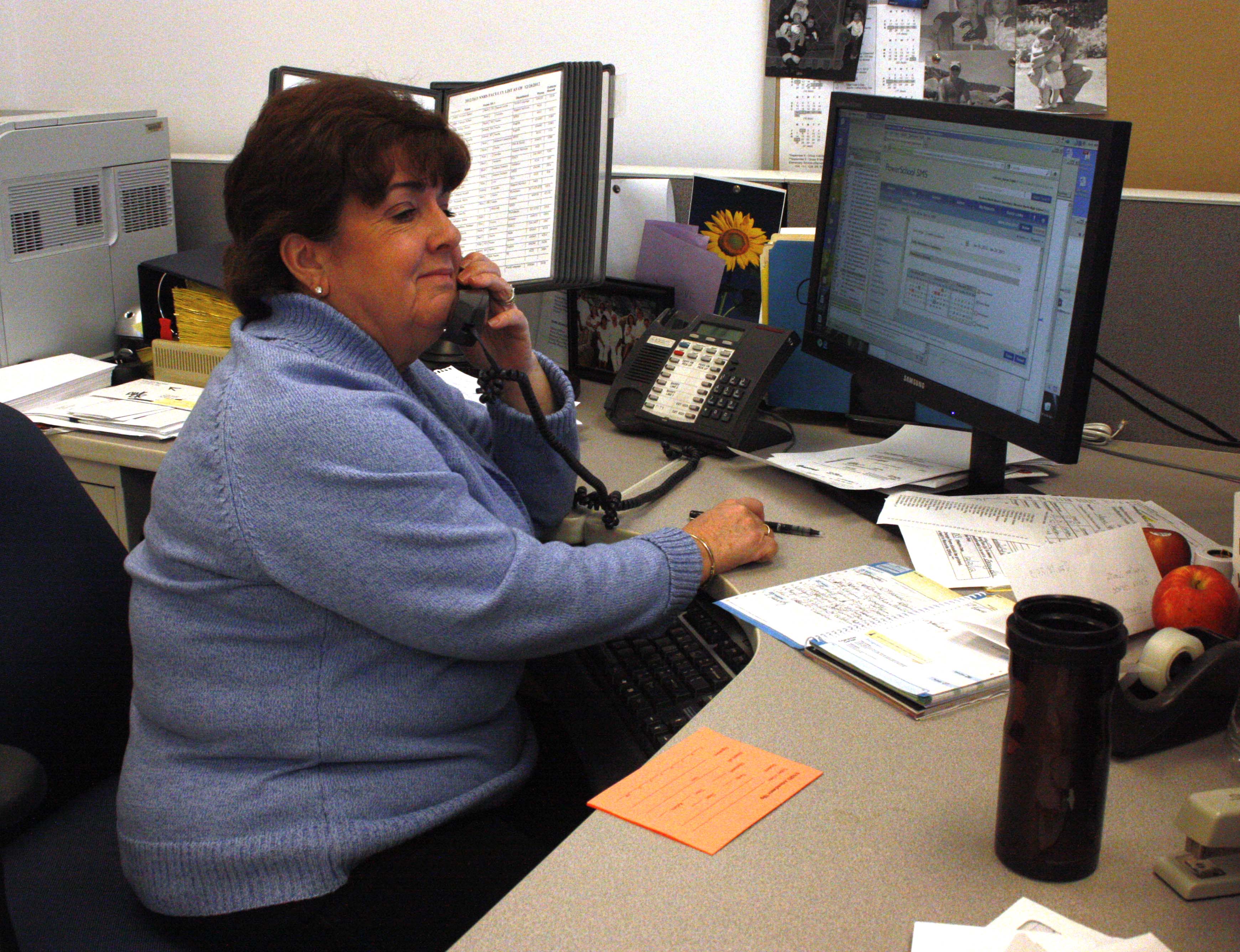 Barry's house secretary Karen Tobin writes down what students will be absent.