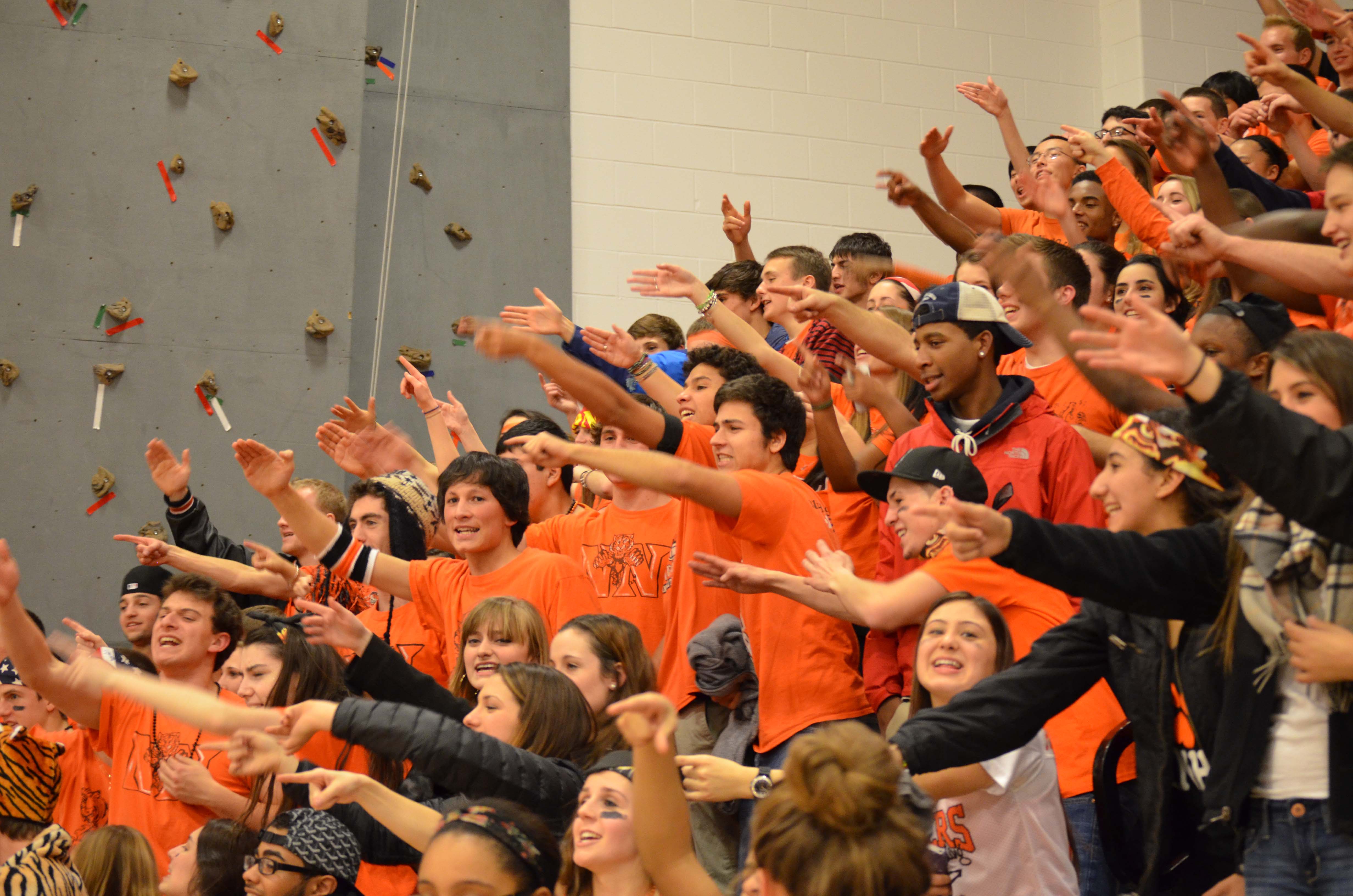During a boys' basketball game, senior cheer on the Tigers as part of the 6th Man tradition.