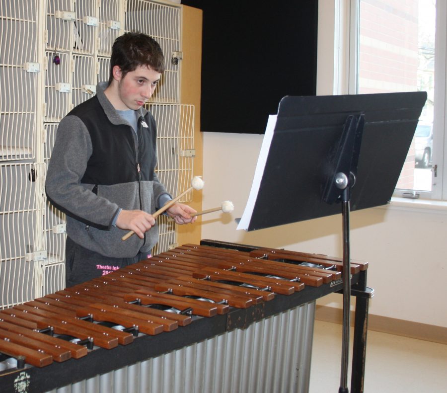Senior Billy Cohen prepares for Winterfest with the rest of the members of Wind Ensemble.