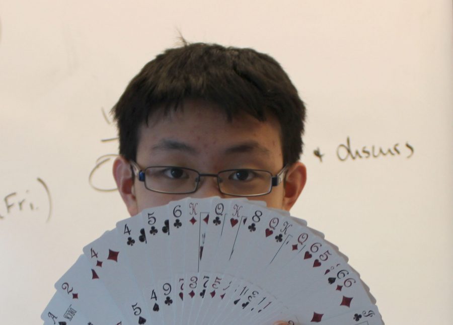 Freshman Sam Lam performs a magic trick Thursday. Lam became a magician after observing a magician perform a trick when he was in kindergarten. 