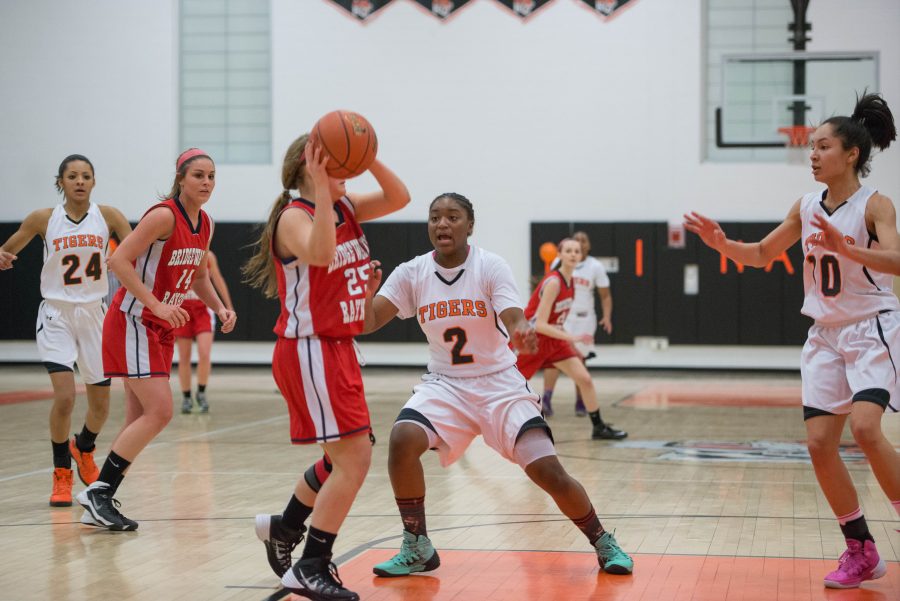 Freshman Sayawni Lassiter defends against Westford Academy on Tuesday