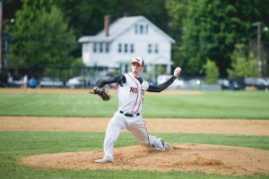 Senior Teddy Rodliff pitches against Catholic Memorial. Photo by Judith Gibson-Okunieff.