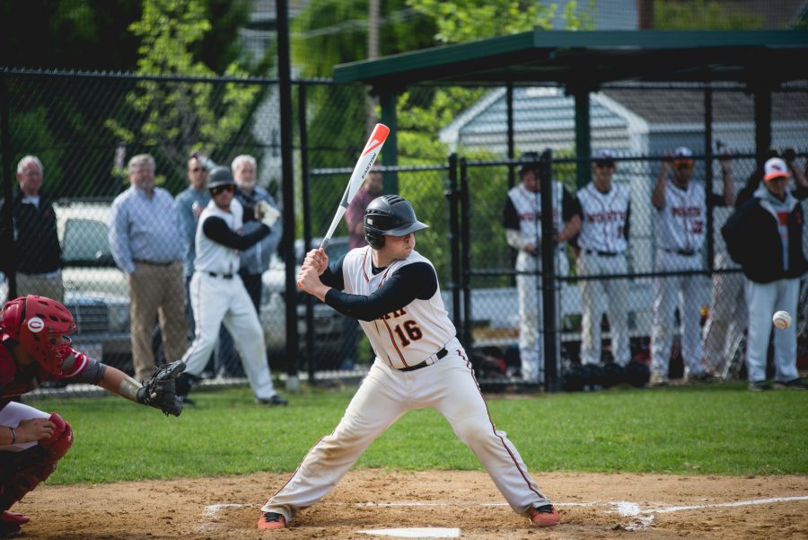 Senior captain Alex Joyce digs in at the plate against Catholic Memorial yesterday . Photo by Judith Gibson-Okunieff.