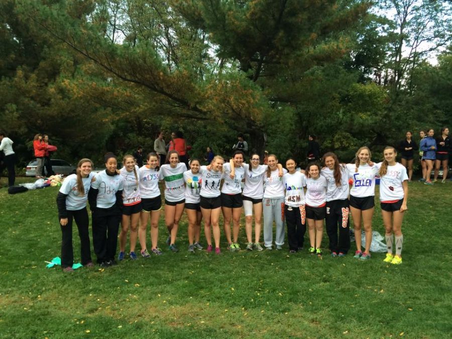 Girls cross country seniors pose for a picture. Courtesy of Laura Schlossman.