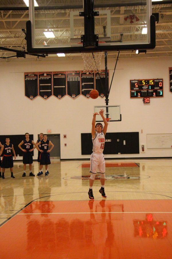 Mobley shoots a free throw in a 71-46 boys basketball win over Walpole Dec. 12.