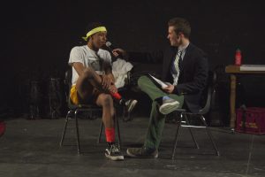 Senior Jelani Asim answers questions from this year's host, senior Ethan Plotkin, during the Q&A portion. Photo by Josh Shub-Seltzer