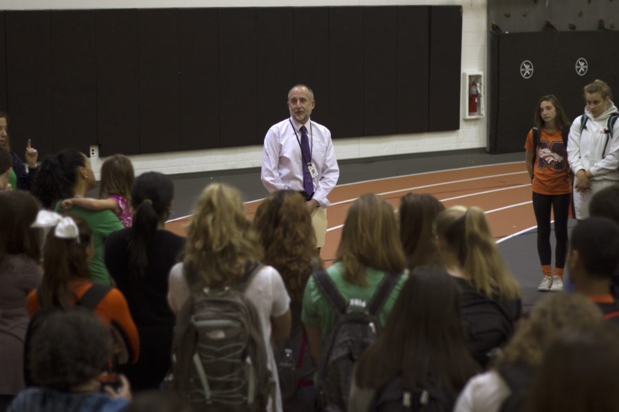 Interim principal Mark Aronson speaks to students in the SOA before the moment of silence. Photo by Josh Shub-Seltzer.