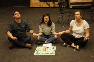 Director and senior Jackson Bunis and juniors Annabelle Tocco and Natalie Cotter rehearse a sketch for Nitrous Oxide.