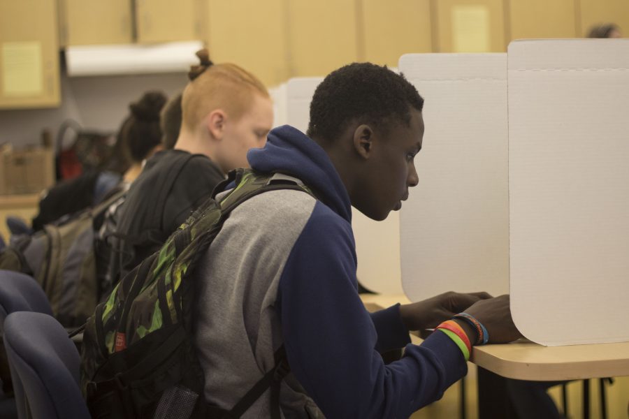 Students vote in the mock election on Chromebooks in the International Cafe Tuesday, November 8. Photo by Josh Shub-Seltzer