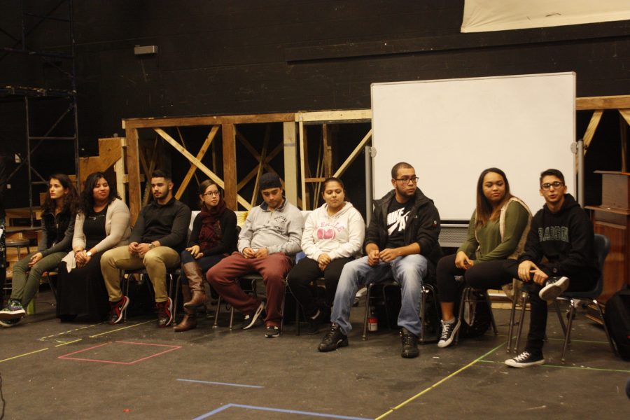 Eight student panelists discuss their Hispanic heritage Wednesday during E-block in the Little Theatre.
