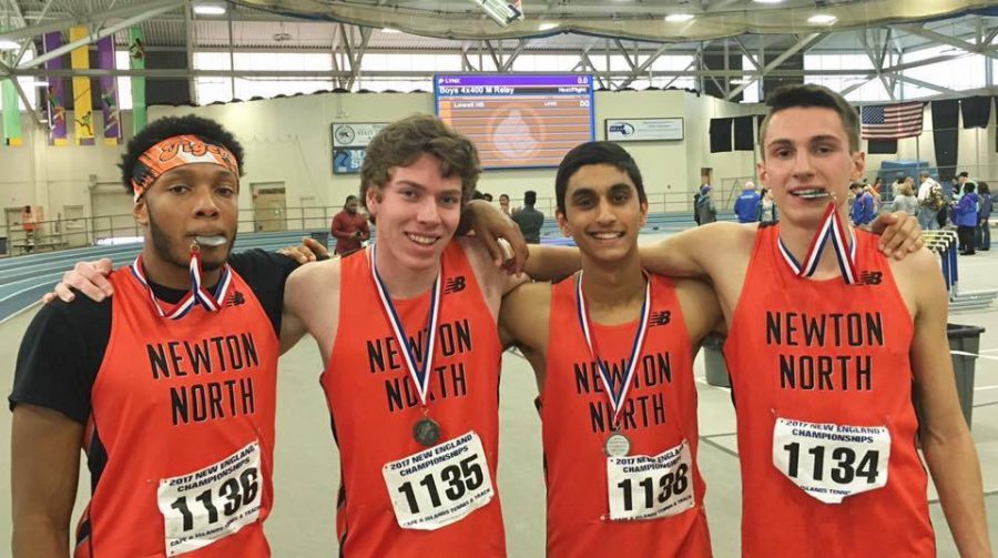 The boys' 4x400 meter relay team poses for a picture after their school record-breaking race, placing second in the meet. Left to right: senior Jordan Greene, junior Devin Coughlin, freshman Ragav Kadambi, sophomore Theo Burba. Photo courtesy of Brian Burba.