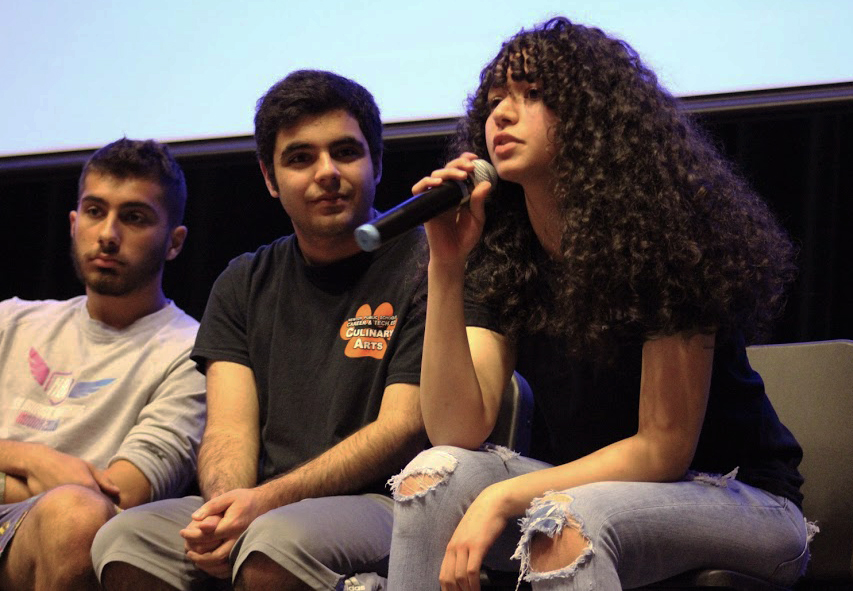 Seniors Noah Shanshiry, Odin Silawi and junior Armin Alirezai answer audience questions during d-block of Middle East Day. (Photo by Joelle Sugianto)