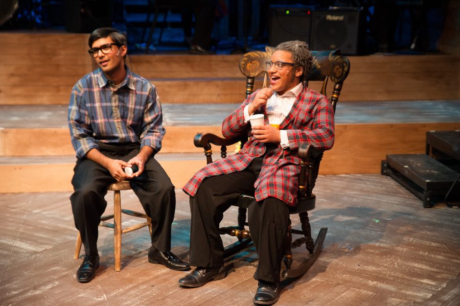 Seniors Achille Ricca and Amar Ahmad, playing father and son, have a light-hearted talk. (Photo courtesy of Neil J Halin) 
