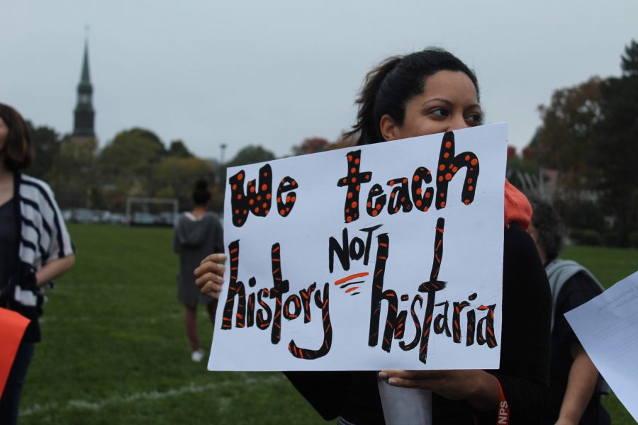 Teachers hold signs in support of current history curricula during Octobers standout. (Photo by Joelle Sugianto)