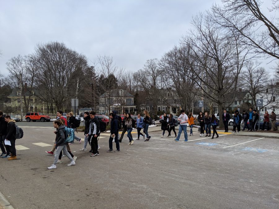 Students return to the building through the Theatre entrance after the emergency evacuation March 14. (Photo by Ian Dickerman)