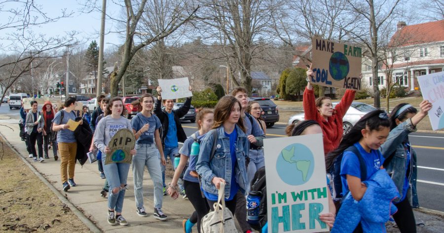 North and South students participate in a climate march organized by Norths Next Generation Voices club after school Friday, March 15. (Photo by Joel Schurgin)