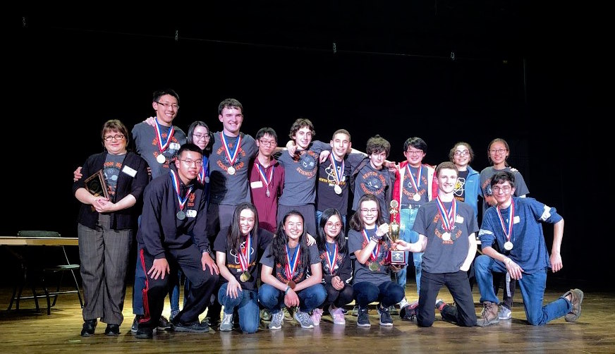 The Science Olympiad team poses for a photo with the trophy after the competition. (Photo by Ian Martin)