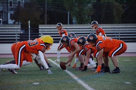 Members of the football team scrimmage before the Friday Night Lights Game on Friday, Oct. 19. (Photo by Ian Dickerman)