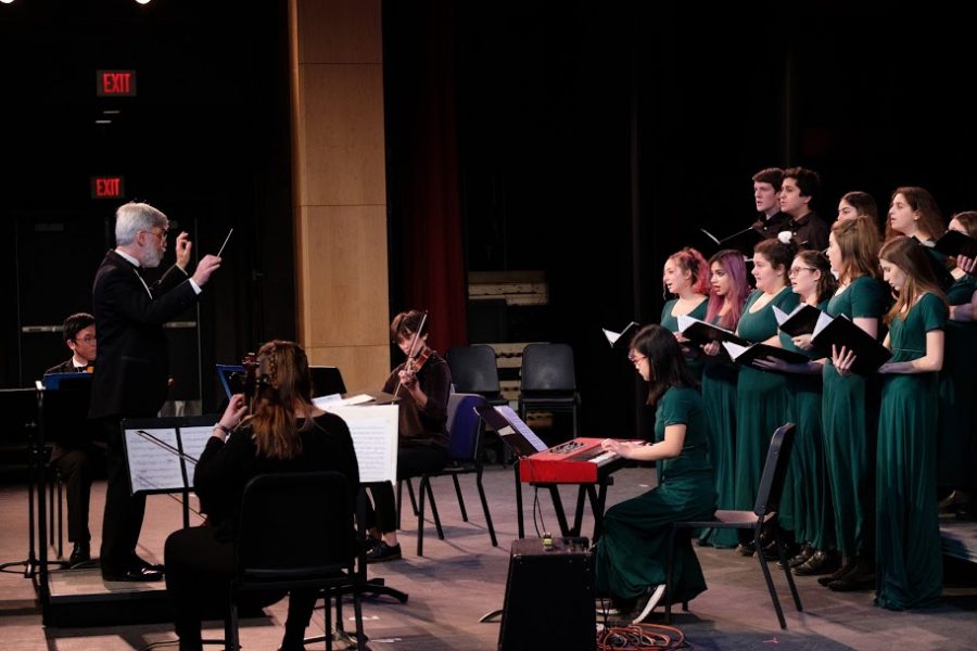 The Family Singers, conducted by Adam Grossman, perform during Winterfest II in the auditorium. (Photo by Ian DIckerman)
