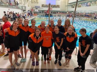Members of the girls swim and dive team before they compete at the state championship.