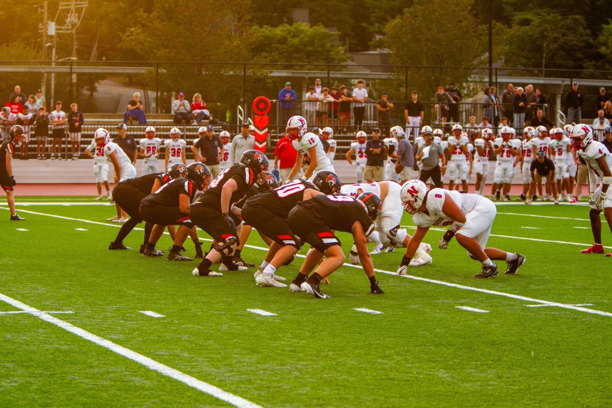 Football players prepare for snap, Friday Sept. 6. 