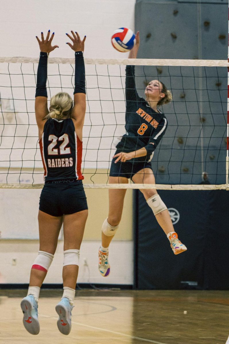 Senior Devon Burke reaches for ball Friday, Sept. 13.