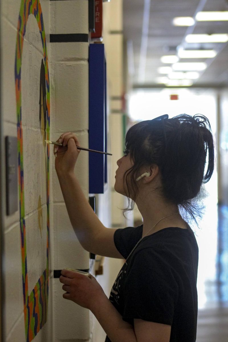 Stephanie Fraktman, Class of 2024, worked on her mural last spring Thursday, March 21.