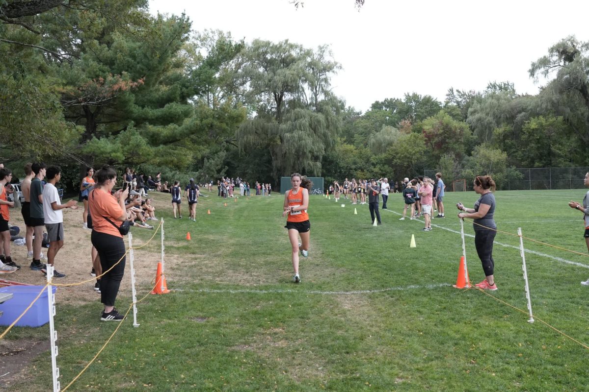 Senior Ciara Evans crosses the finish line Wednesday, Sept. 18. 