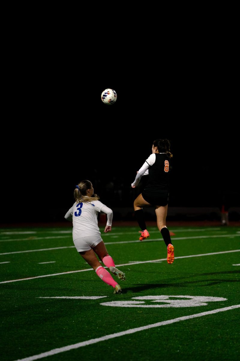 Junior Bella Mangada fights for header Monday, Nov. 4. 