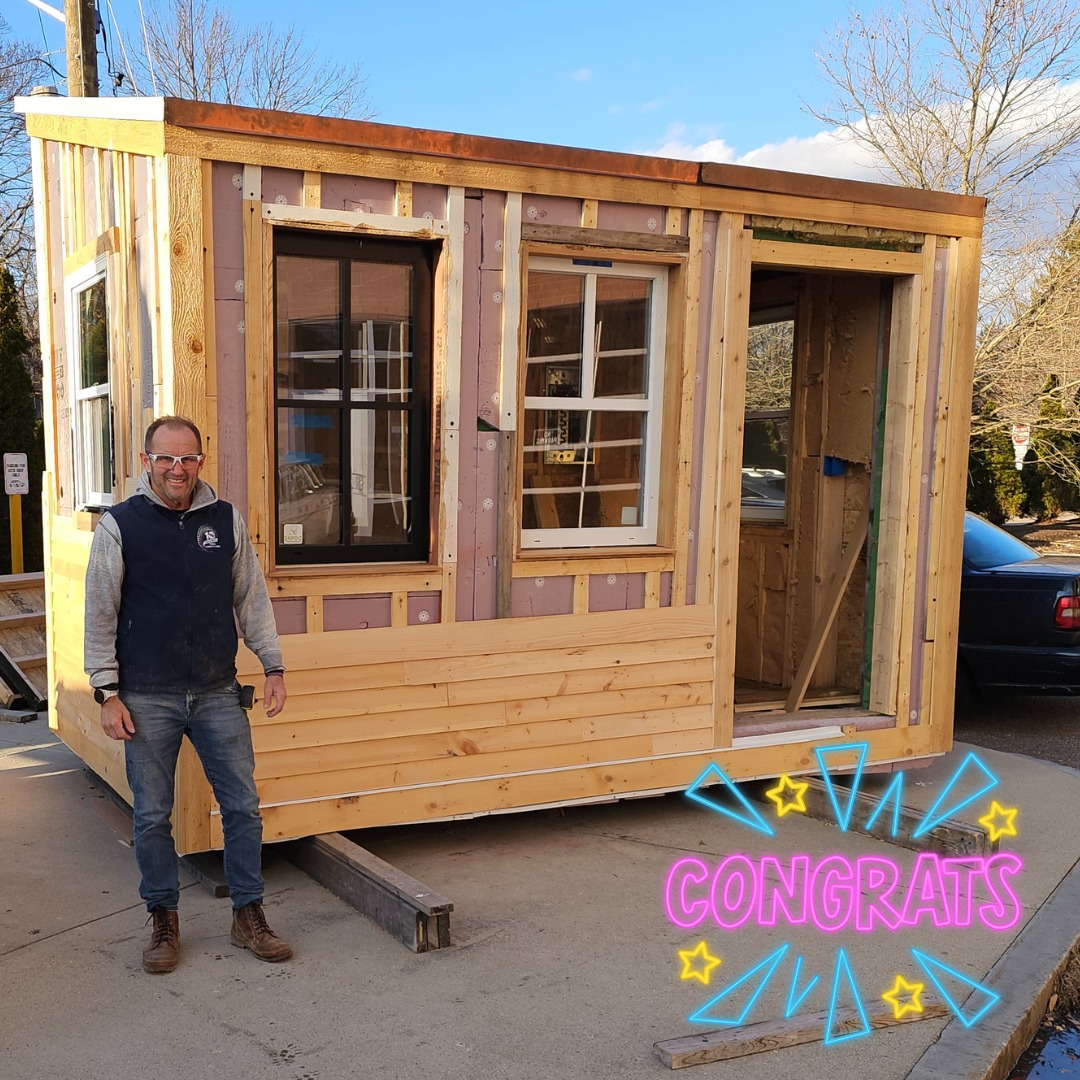 Tingle stands next to his completed tiny home project, Friday, Dec. 14 2024. 