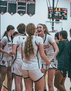 Senior captain Devon Burke and freshman Annabelle Wardly celebrate their win Friday, Jan. 24. 