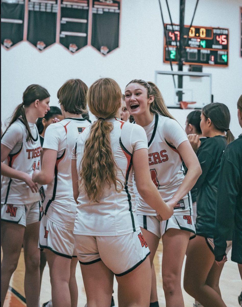 Senior captain Devon Burke and freshman Annabelle Wardly celebrate their win Friday, Jan. 24. 