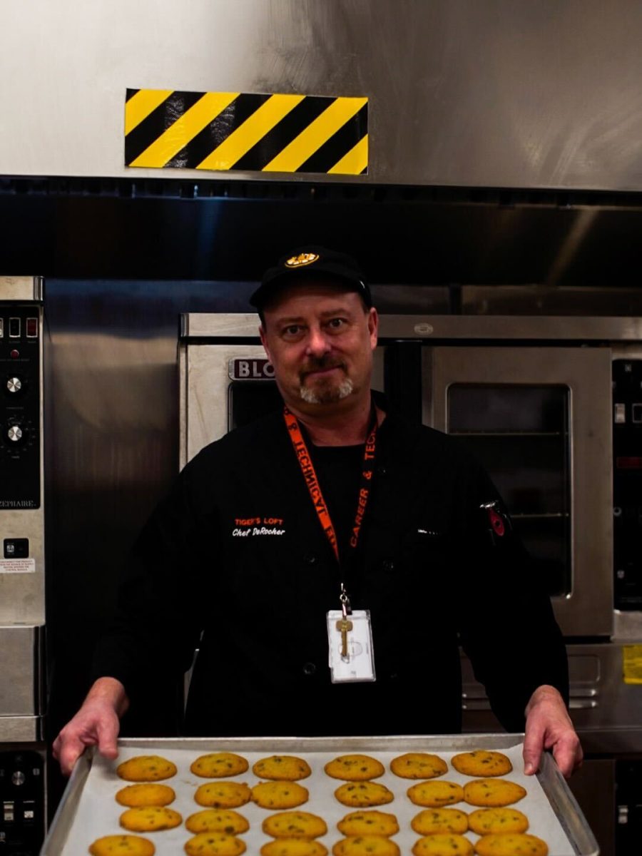 Culinary teacher Christopher DeRocher presents a fresh batch of cookies Thursday, Feb. 13. 