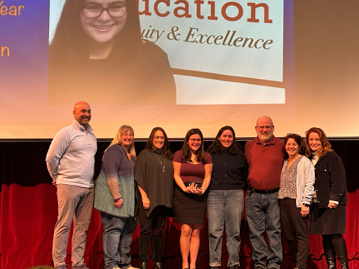 Donnellan Receives Annual CTE Award, standing with CTE falulty Thursday, Jan. 30.

