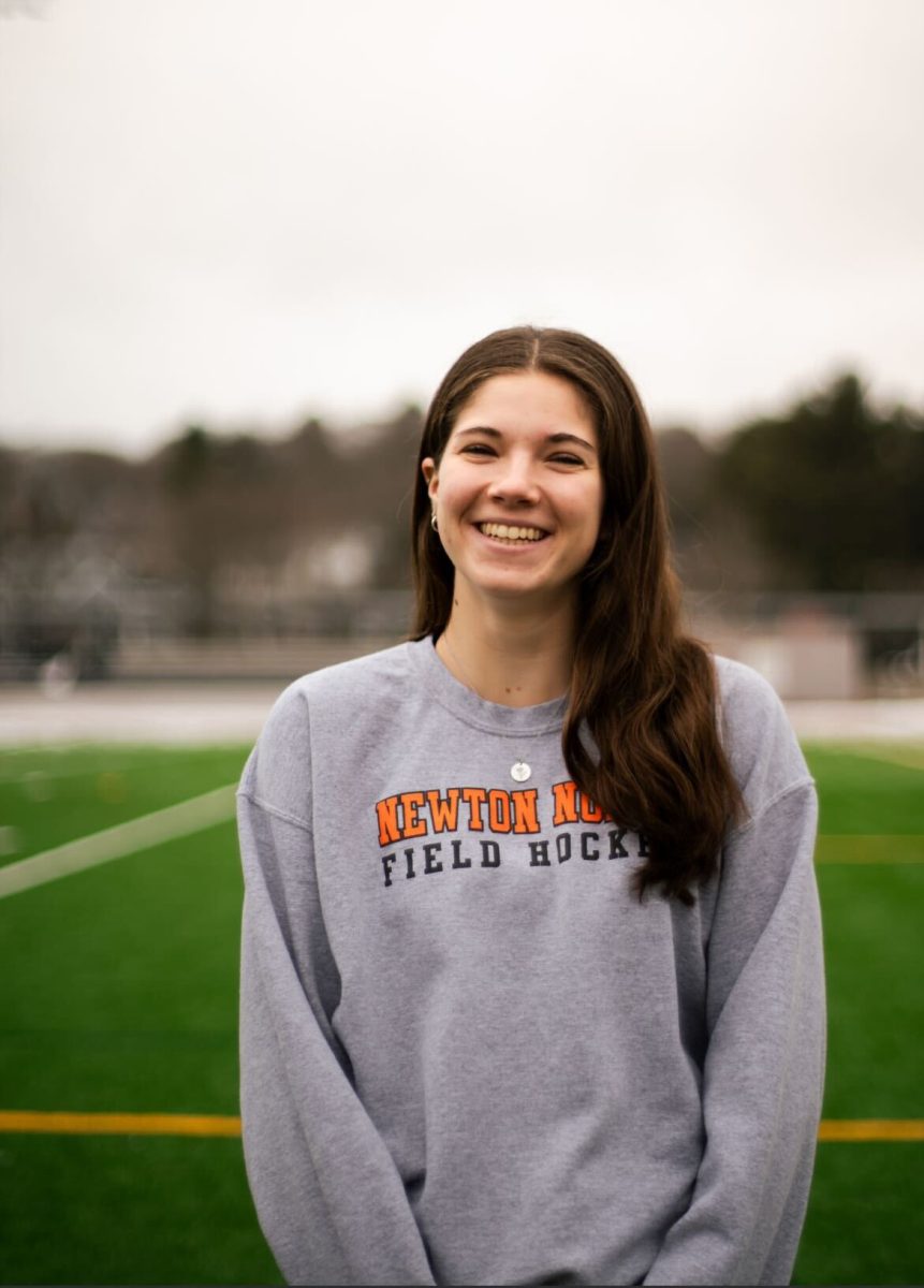 Senior Macy Goodwin flashes a smile as she poses in front of the turf Tuesday, Feb. 4.