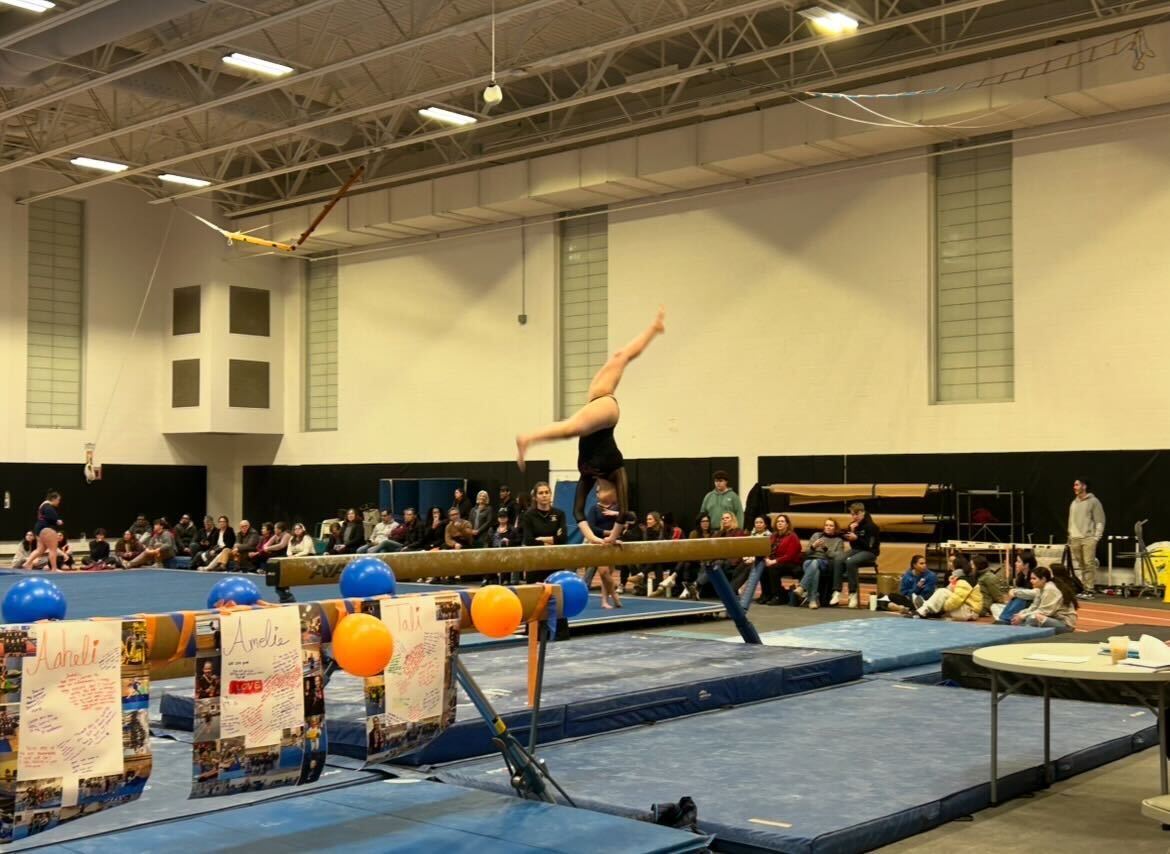 Gymnastics beats Natick in tight meet, stays undefeated