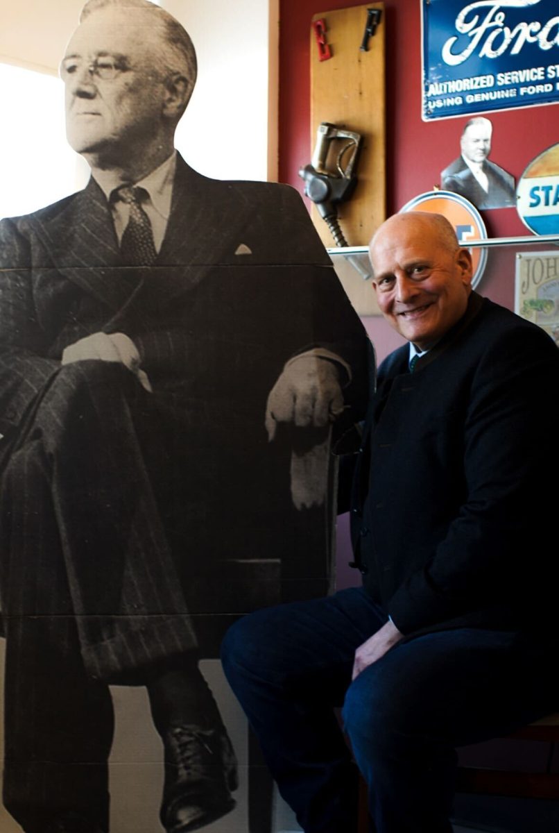 History teacher Brian Goeselt, upon request, sits alongside his cutout of Harry Truman in order to have "two great historians" in the photo Thursday, Feb. 13. 