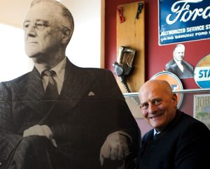 History teacher Brian Goeselt, upon request, sits alongside his cutout of Harry Truman in order to have "two great historians" in the photo Thursday, Feb. 13. 