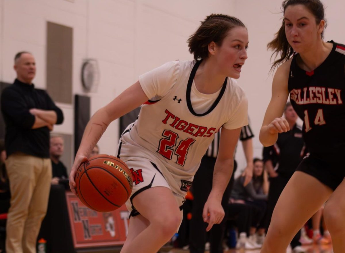 Junior Allie Danis directs the court while dribbling Friday, Jan. 31. 