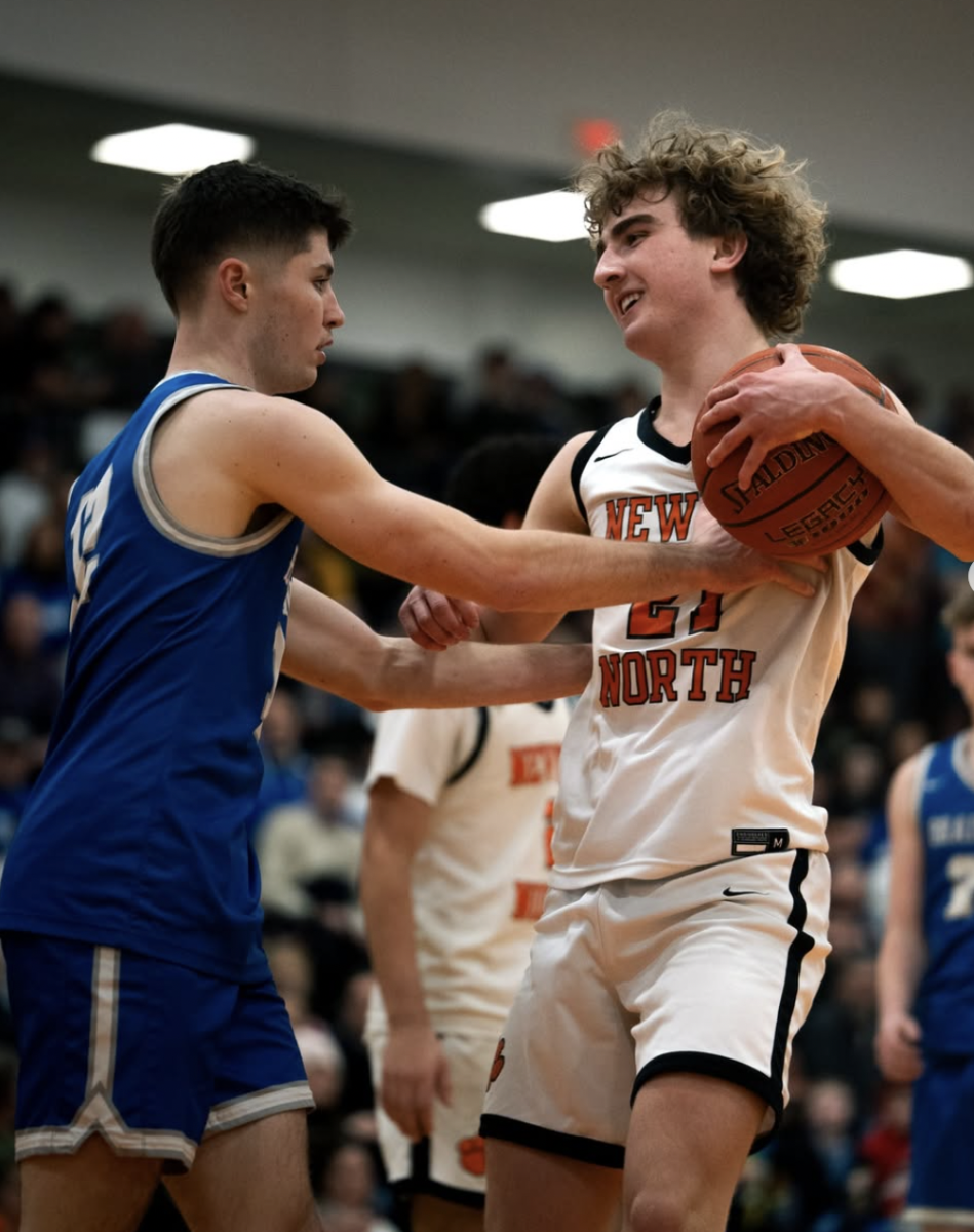 Senior Nicky Spinelli protects the ball from a Braintree defender Friday, March 7. 