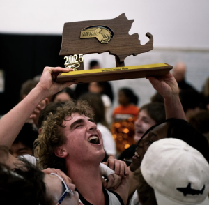 Senior Nicky Spinelli proudly holds the Final Four trophy Friday, March 7.