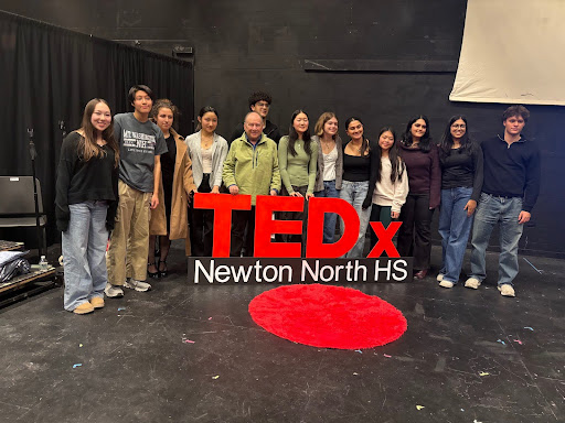 Members and speakers from the TEDx event stand together after the event, Wednesday, Feb. 12.
