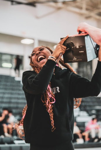 Senior Tarene Cunningham runs to claim her new JBL speaker, Tuesday, April 15. 
