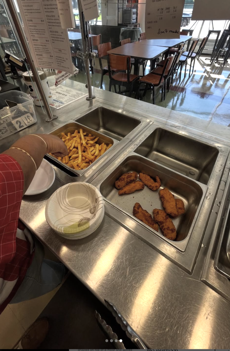 Students begin serving up chicken tenders and fries during lunch on opening day, Wednesday, Oct. 1.