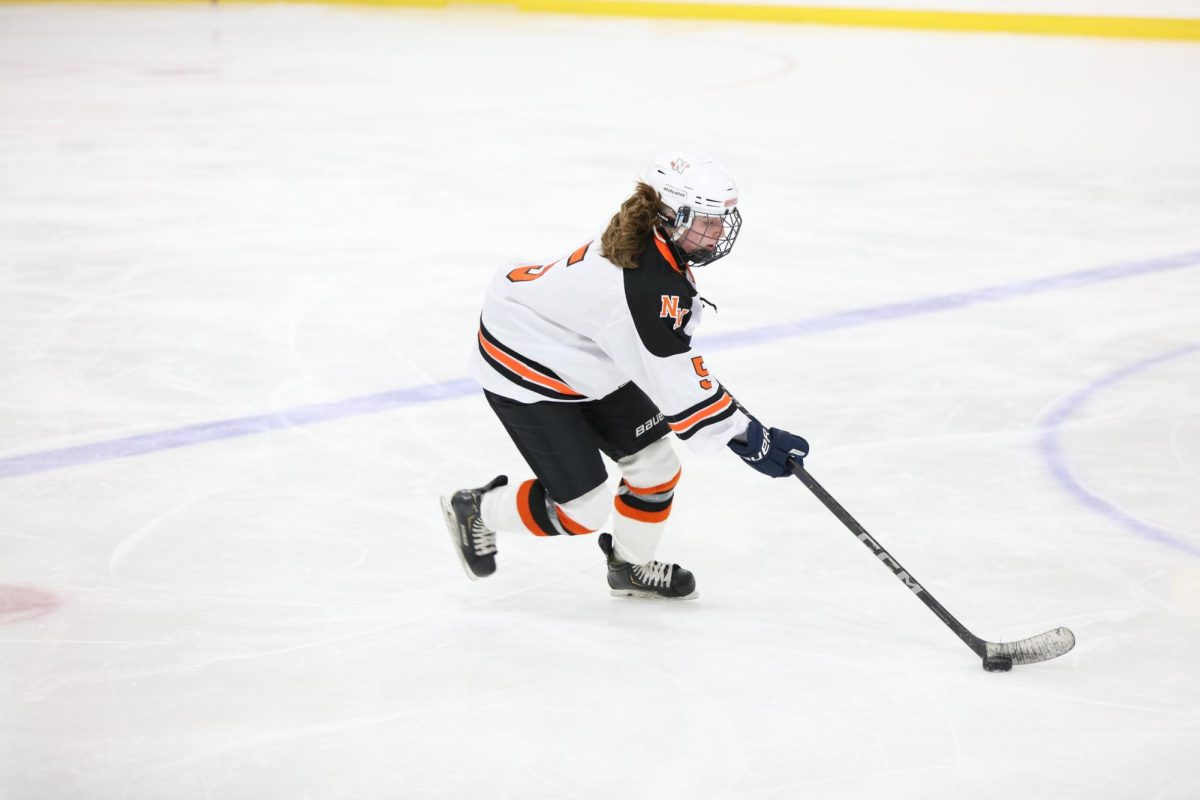 Senior captain Lexi Blanchfield effortlessly skates into Natick's zone.