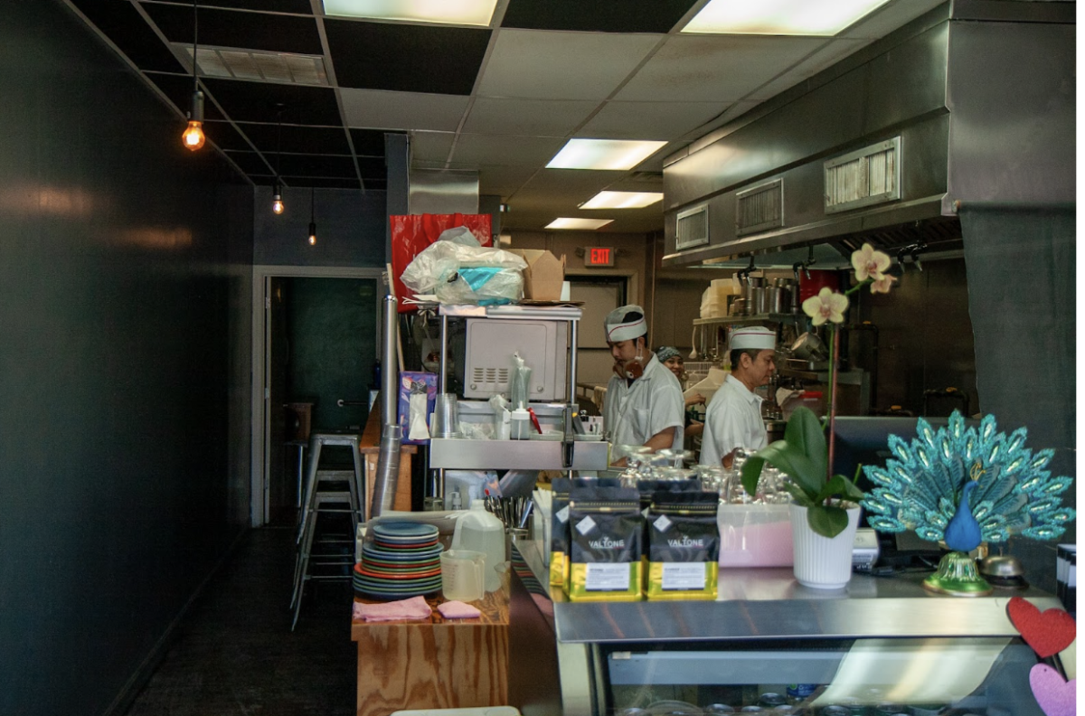 Cooks prepare dishes behind counter at Amarin of Thailand, Friday Jan. 9. 