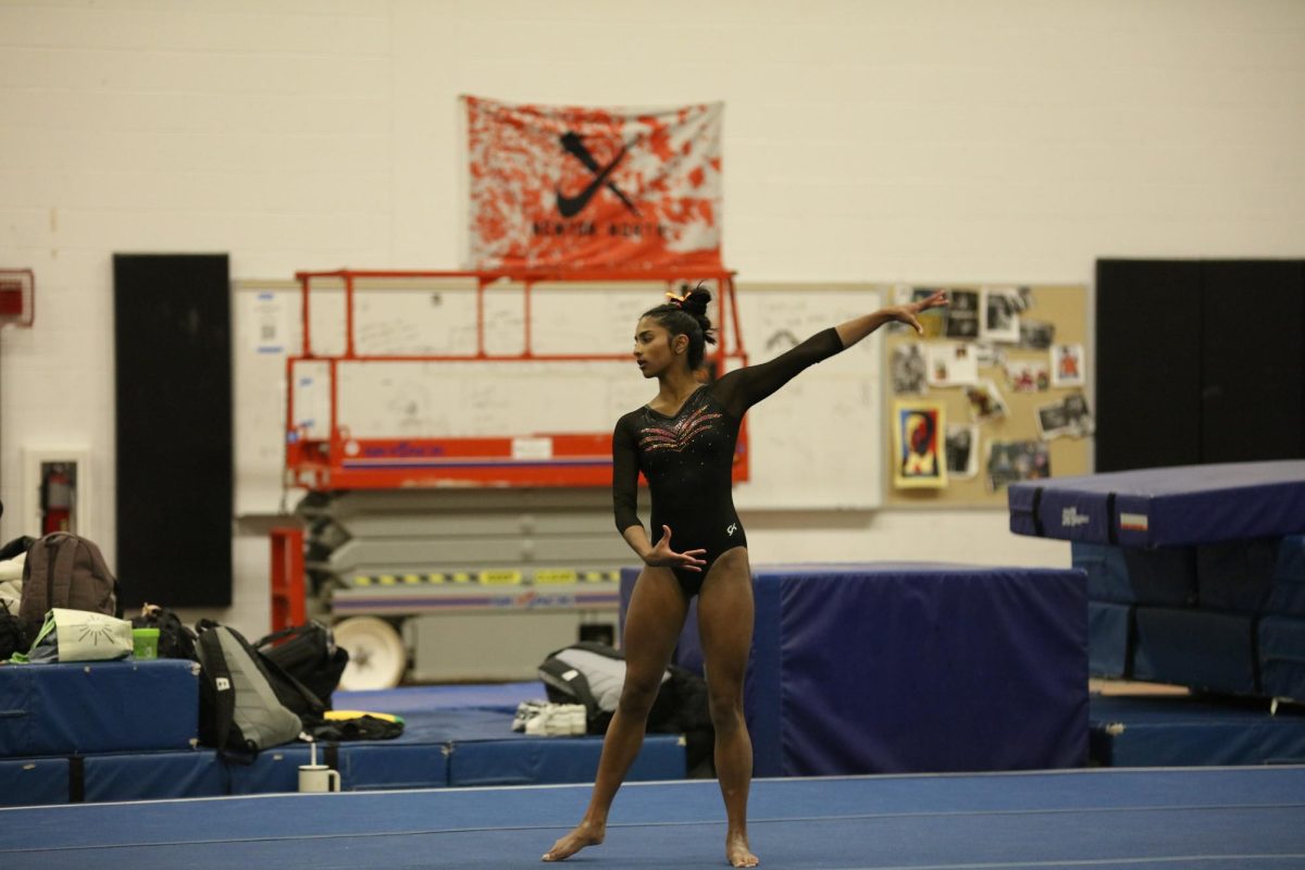 Senior Nika Jayanth poses after a successful floor routine, Friday, Jan. 23.