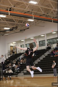 Senior Luca Peterson leaps into the air, Thursday, May 12, in the Reggie.